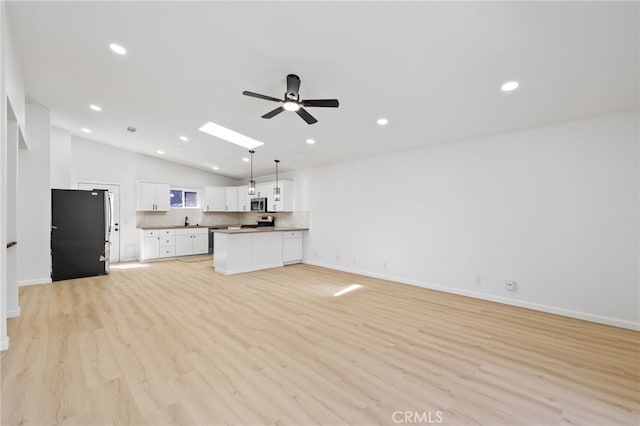 3516 Illinois Trl, Frazier Park, CA 93225 - unfurnished living room featuring light wood-type flooring, vaulted ceiling, ceiling fan, and recessed lighting