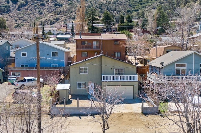 3516 Illinois Trl, Frazier Park, CA 93225 - view of front facade with a balcony, driveway, a residential view, and a garage