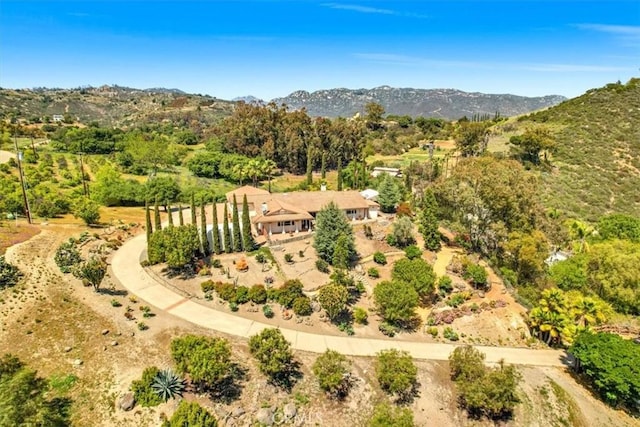 birds eye view of property featuring a mountain view
