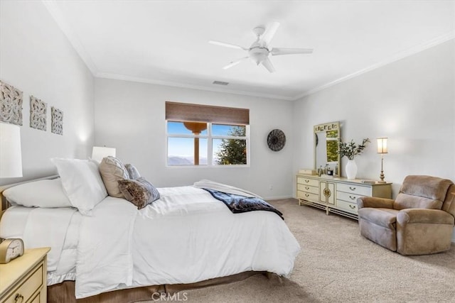 bedroom featuring ceiling fan, ornamental molding, visible vents, and carpet