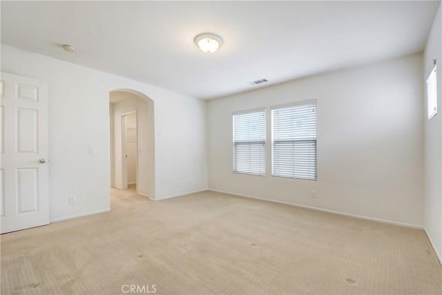 5 Chinaberry, Irvine, CA 92618 - spare room featuring arched walkways, light colored carpet, baseboards, and a smoke detector