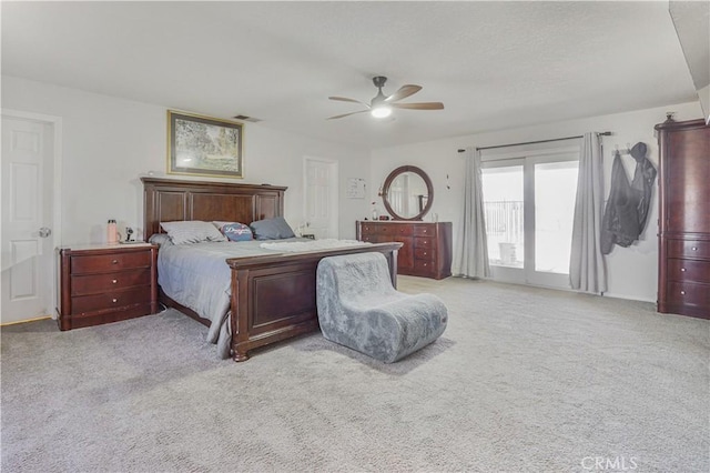 6748 Coriander Dr, Oak Hills, CA 92344 - carpeted bedroom featuring visible vents and a ceiling fan