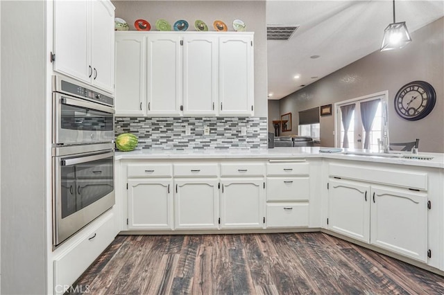6748 Coriander Dr, Oak Hills, CA 92344 - kitchen featuring light countertops, white cabinetry, stainless steel double oven, and a sink