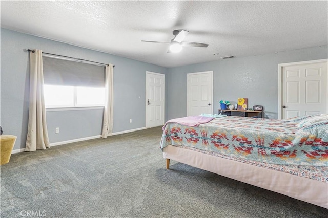 6748 Coriander Dr, Oak Hills, CA 92344 - carpeted bedroom featuring a textured ceiling, visible vents, baseboards, and ceiling fan