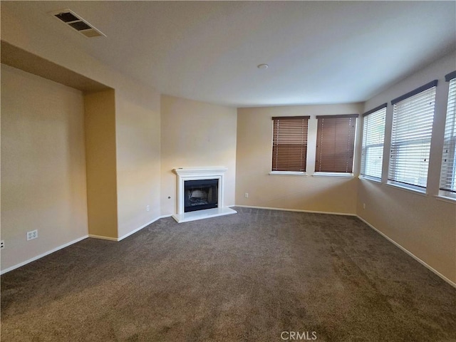 1480 Bedford Ct, Beaumont, CA 92223 - unfurnished living room featuring carpet flooring, a fireplace with raised hearth, and baseboards