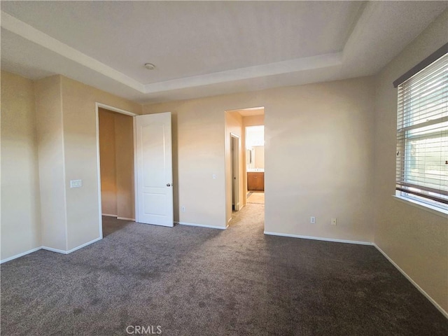1480 Bedford Ct, Beaumont, CA 92223 - unfurnished bedroom featuring carpet flooring, a raised ceiling, and baseboards