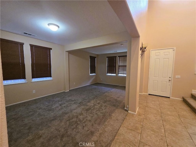 1480 Bedford Ct, Beaumont, CA 92223 - carpeted spare room featuring tile patterned floors and baseboards
