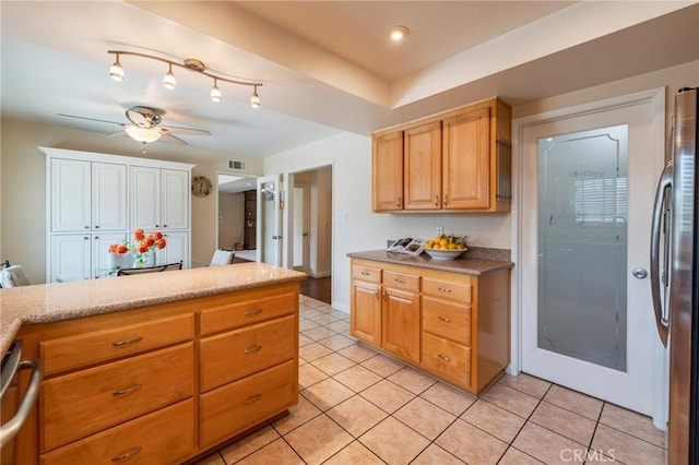 637 Anson St, Simi Valley, CA 93065 - kitchen featuring stainless steel appliances, a ceiling fan, light tile patterned floors, and light countertops