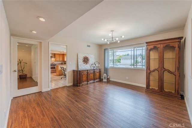 637 Anson St, Simi Valley, CA 93065 - living area featuring a chandelier, wood finished floors, and baseboards