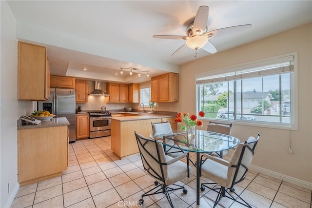 637 Anson St, Simi Valley, CA 93065 - dining space featuring light tile patterned flooring, ceiling fan, a raised ceiling, and baseboards