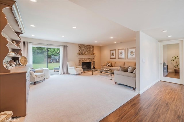 637 Anson St, Simi Valley, CA 93065 - living area with light wood finished floors, a fireplace, recessed lighting, and baseboards