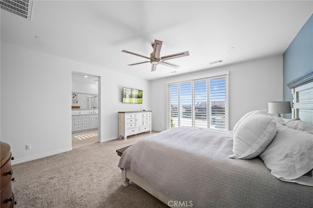 bedroom featuring carpet flooring, baseboards, a ceiling fan, and ensuite bathroom