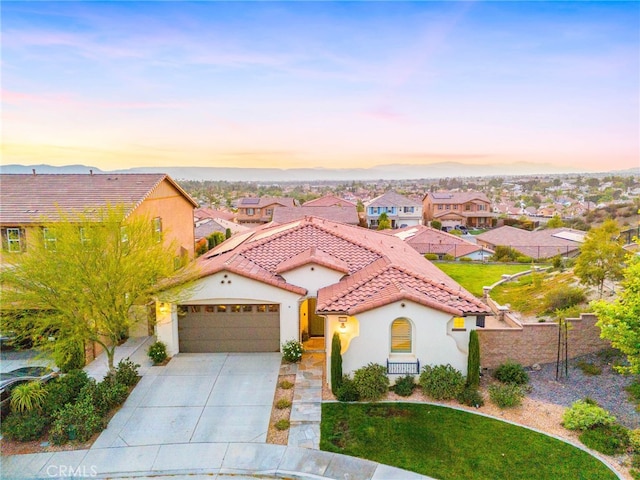 40571 Alder Ct, Temecula, CA 92591 - mediterranean / spanish-style house with stucco siding, a tile roof, a garage, driveway, and a residential view