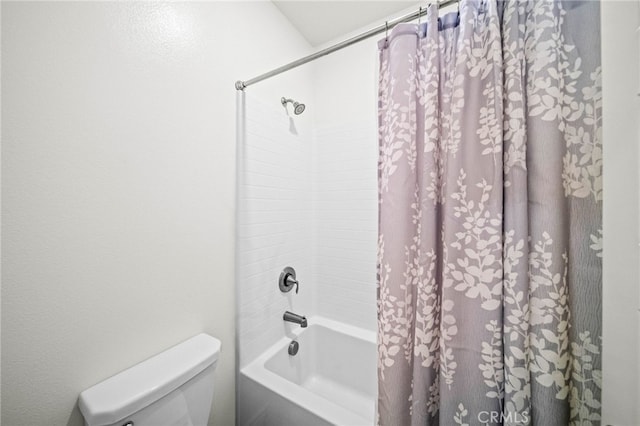 full bathroom featuring shower / tub combo and toilet