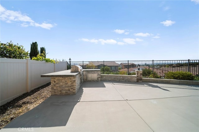 40571 Alder Ct, Temecula, CA 92591 - view of patio / terrace featuring area for grilling, a fenced backyard, and a grill