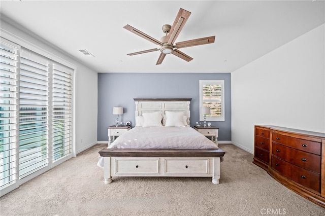 bedroom with light carpet, baseboards, access to outside, and ceiling fan