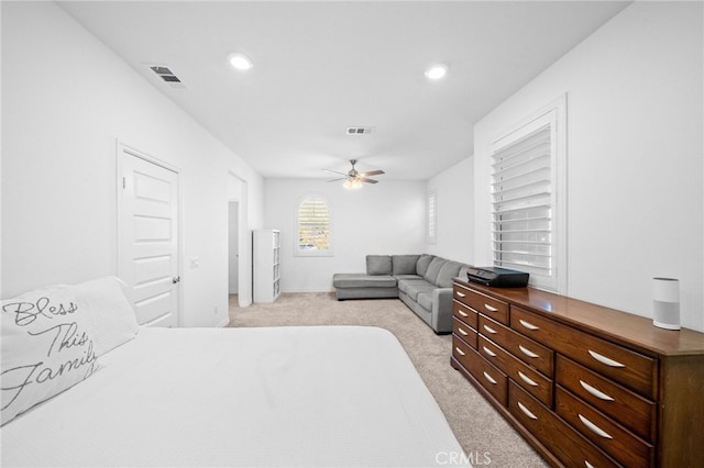 bedroom with light colored carpet, ceiling fan, and recessed lighting