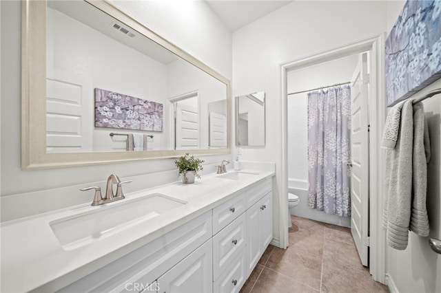 full bath featuring toilet, double vanity, tile patterned floors, and shower / bathtub combination with curtain