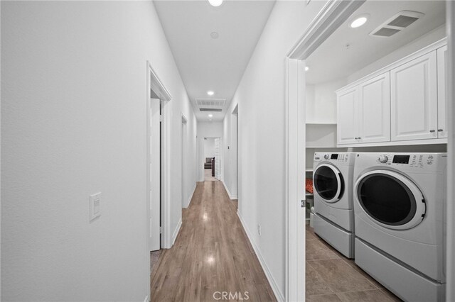 40571 Alder Ct, Temecula, CA 92591 - laundry room featuring washing machine and clothes dryer, cabinet space, recessed lighting, baseboards, and light wood-type flooring