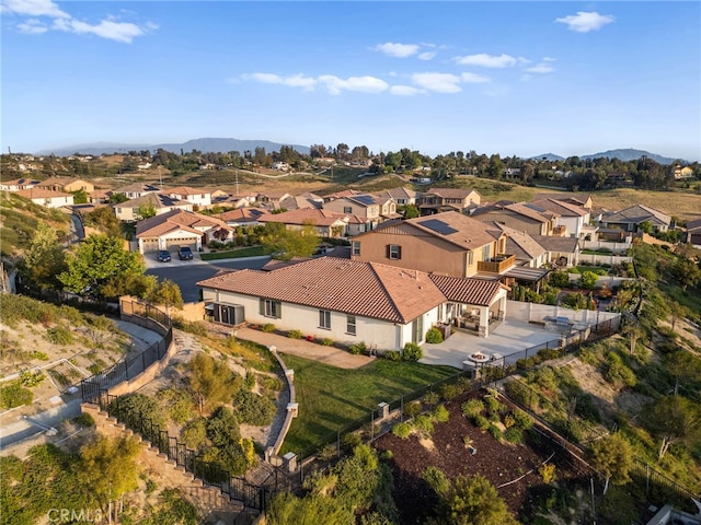 aerial perspective of suburban area with a mountainous background