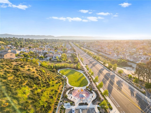 aerial view of residential area featuring a mountainous background