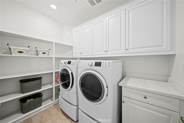 40571 Alder Ct, Temecula, CA 92591 - laundry area featuring cabinet space, washer and clothes dryer, and light tile patterned floors