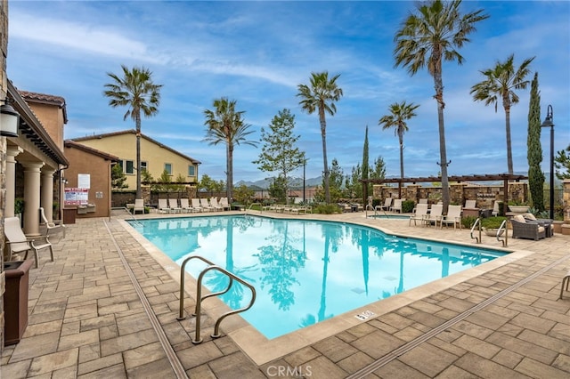 community pool featuring a patio area