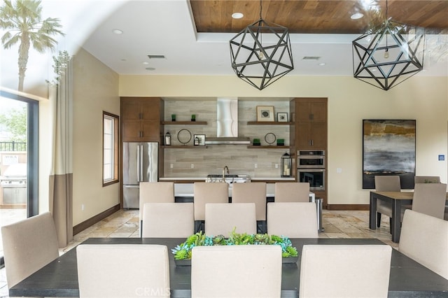 dining area featuring baseboards, recessed lighting, visible vents, and wood ceiling