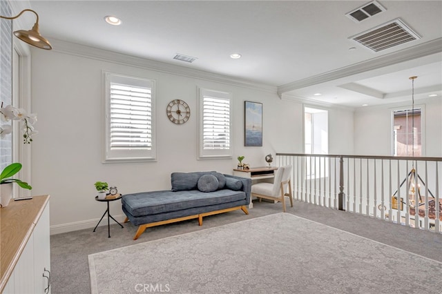 living area with ornamental molding, visible vents, and carpet floors