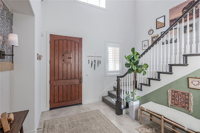 12060 N Azurita Ct, Porter Ranch, CA 91326 - foyer with a towering ceiling, stairway, and baseboards
