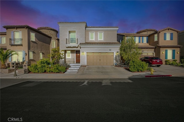 12060 N Azurita Ct, Porter Ranch, CA 91326 - view of front of property featuring concrete driveway, a garage, a tiled roof, and stucco siding