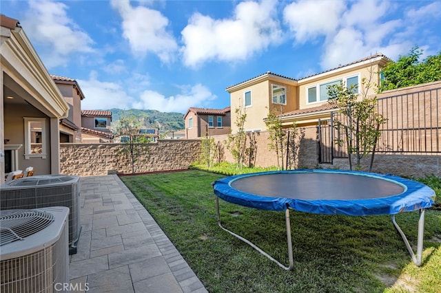 12060 N Azurita Ct, Porter Ranch, CA 91326 - view of yard with a trampoline, central AC unit, and a patio area