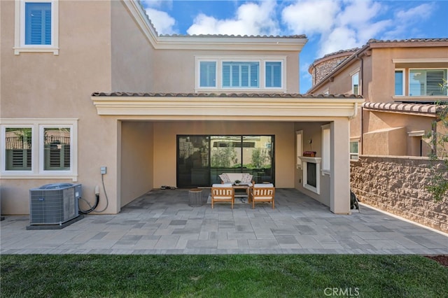 12060 N Azurita Ct, Porter Ranch, CA 91326 - rear view of house featuring cooling unit, a patio area, stucco siding, and an outdoor hangout area