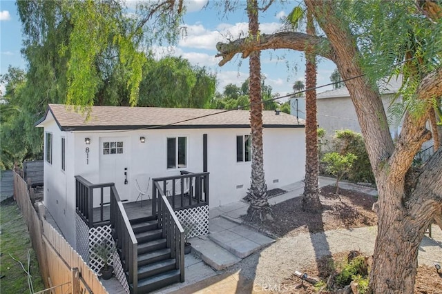 811 W Oliver St, San Pedro, CA 90731 - view of front of house with stucco siding, stairway, a shingled roof, and a deck