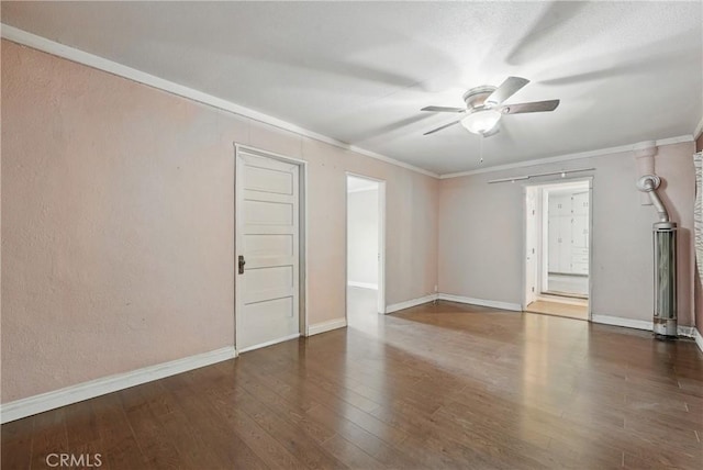 unfurnished room with crown molding, ceiling fan, and wood finished floors