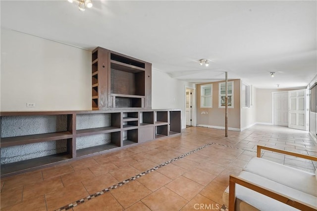 unfurnished living room featuring tile patterned floors