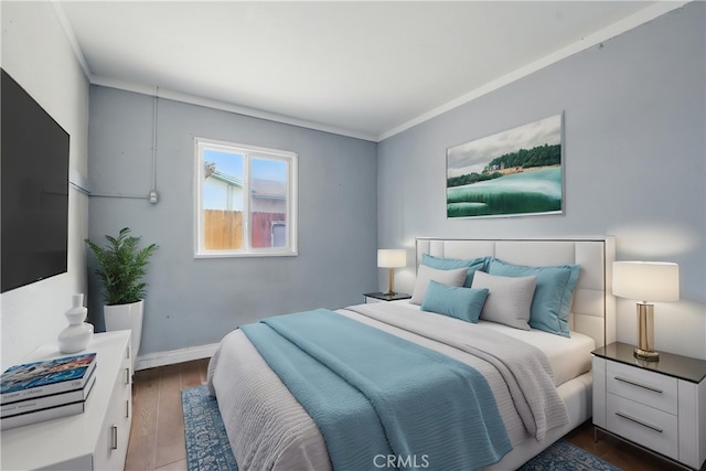 bedroom with baseboards, dark wood-style flooring, and crown molding