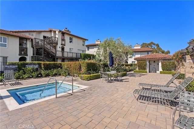 44 Corniche Dr Unit G, Dana Point, CA 92629 - view of pool with a community hot tub and a patio