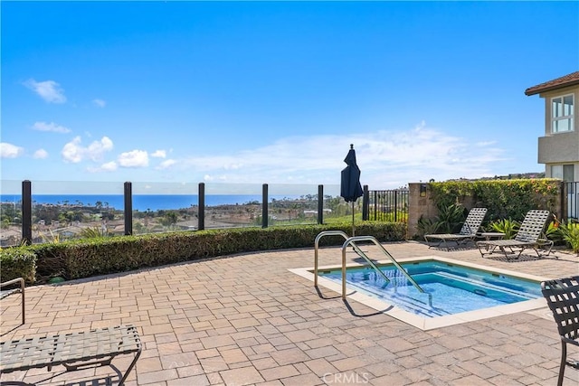 44 Corniche Dr Unit G, Dana Point, CA 92629 - view of swimming pool with a hot tub, fence, a patio, and a water view