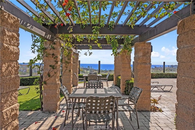 44 Corniche Dr Unit G, Dana Point, CA 92629 - view of patio featuring outdoor dining area and a pergola