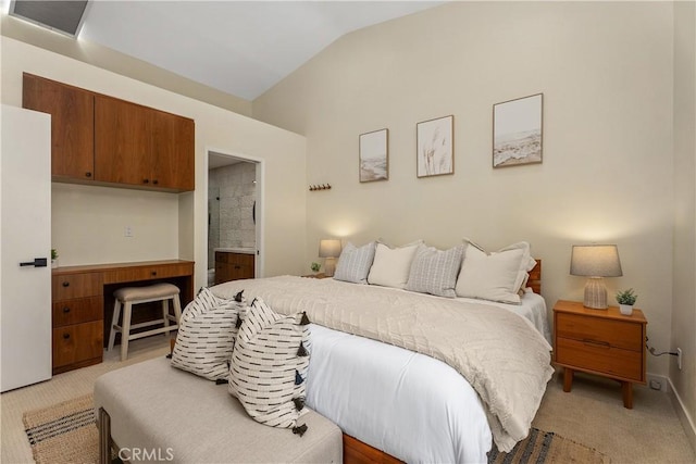 44 Corniche Dr Unit G, Dana Point, CA 92629 - bedroom with light carpet, vaulted ceiling, and connected bathroom