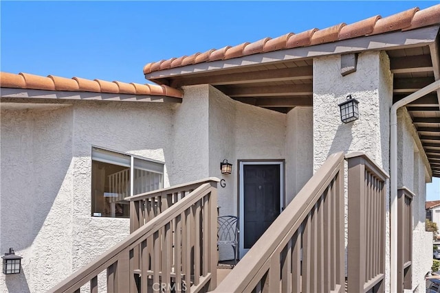 44 Corniche Dr Unit G, Dana Point, CA 92629 - entrance to property with stucco siding and a tiled roof