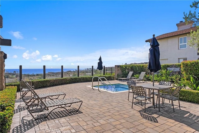 44 Corniche Dr Unit G, Dana Point, CA 92629 - view of swimming pool featuring a patio, fence, a water view, and a swimming pool