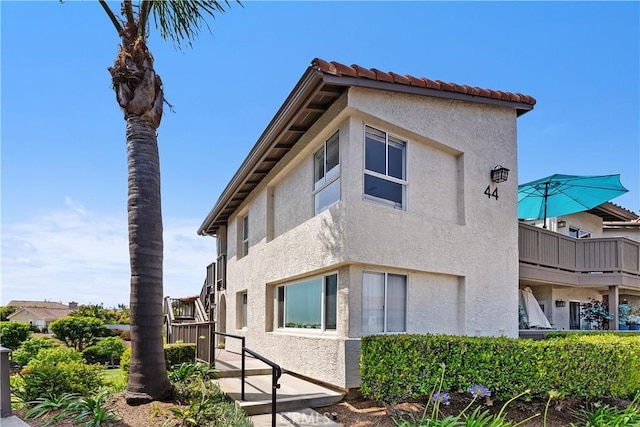 44 Corniche Dr Unit G, Dana Point, CA 92629 - view of side of property with stucco siding
