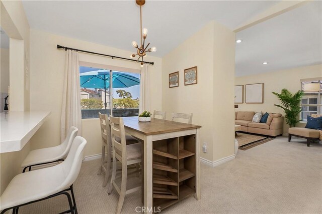 44 Corniche Dr Unit G, Dana Point, CA 92629 - dining area with carpet floors, baseboards, a chandelier, and recessed lighting