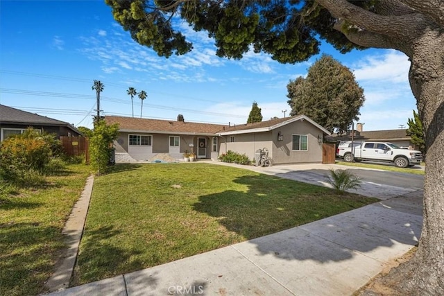 2111 Sanford St, Oxnard, CA 93033 - ranch-style home with stucco siding, a front lawn, and driveway