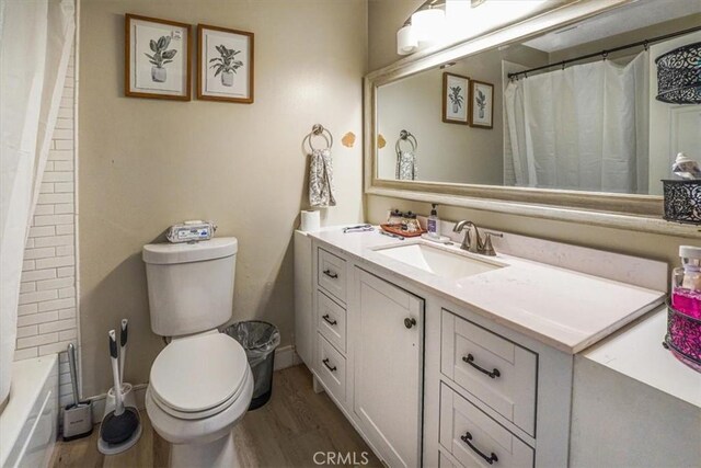 2111 Sanford St, Oxnard, CA 93033 - bathroom with toilet, wood finished floors, and vanity