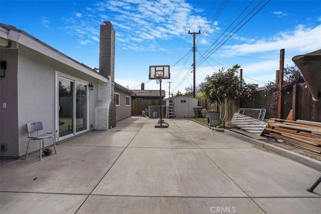 2111 Sanford St, Oxnard, CA 93033 - view of patio / terrace featuring a storage unit, an outdoor structure, and a fenced backyard
