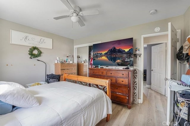 2111 Sanford St, Oxnard, CA 93033 - bedroom with a ceiling fan, a closet, and light wood-style flooring