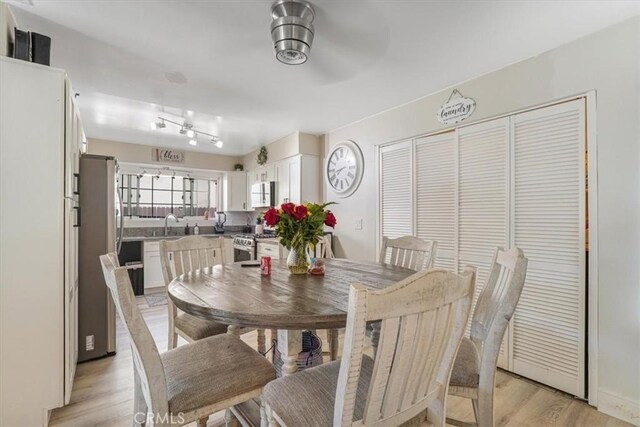 2111 Sanford St, Oxnard, CA 93033 - dining space featuring light wood-style flooring and a ceiling fan